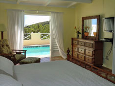 Bedroom suites open to thee pool and views